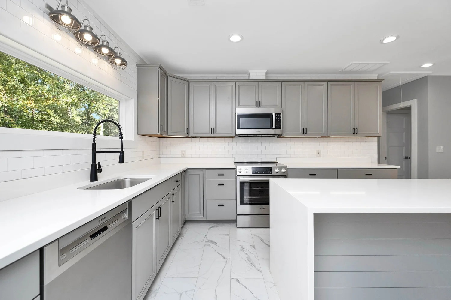 Kitchen remodel with white countertops